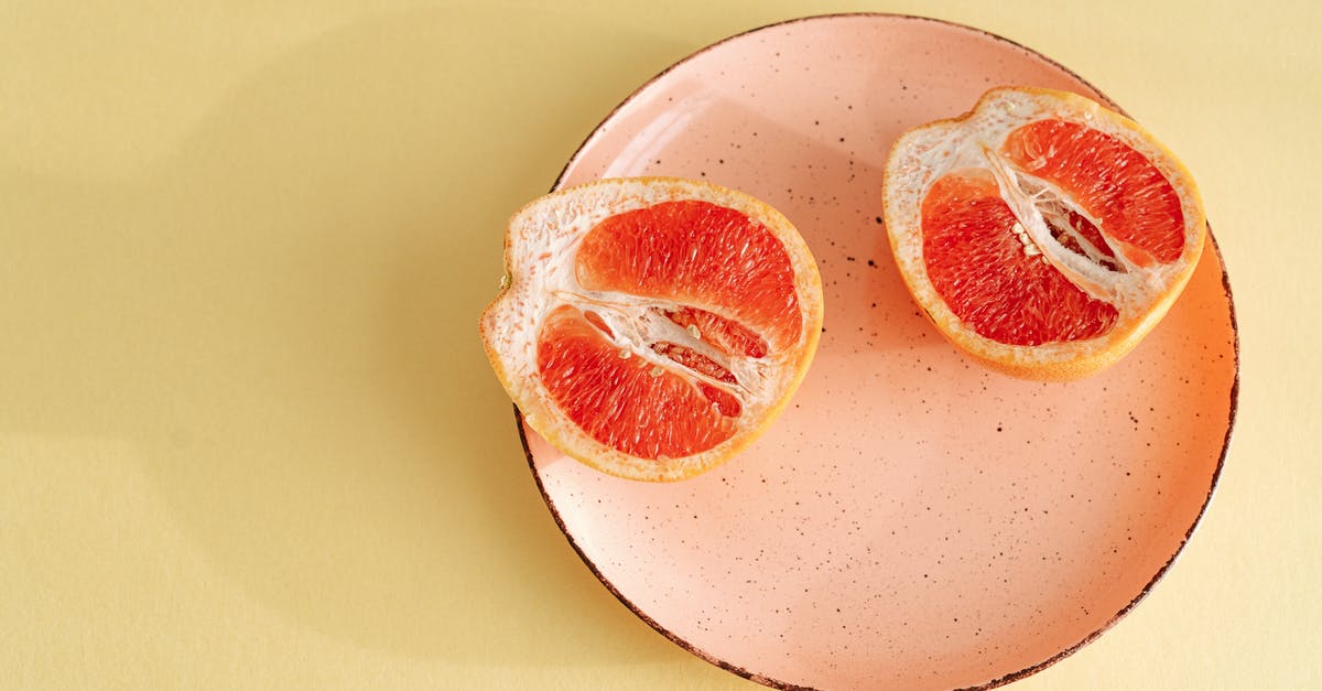 How can I increase the shelf life of a cut onion? [closed] - Sliced Grapefruit on Ceramic Plate