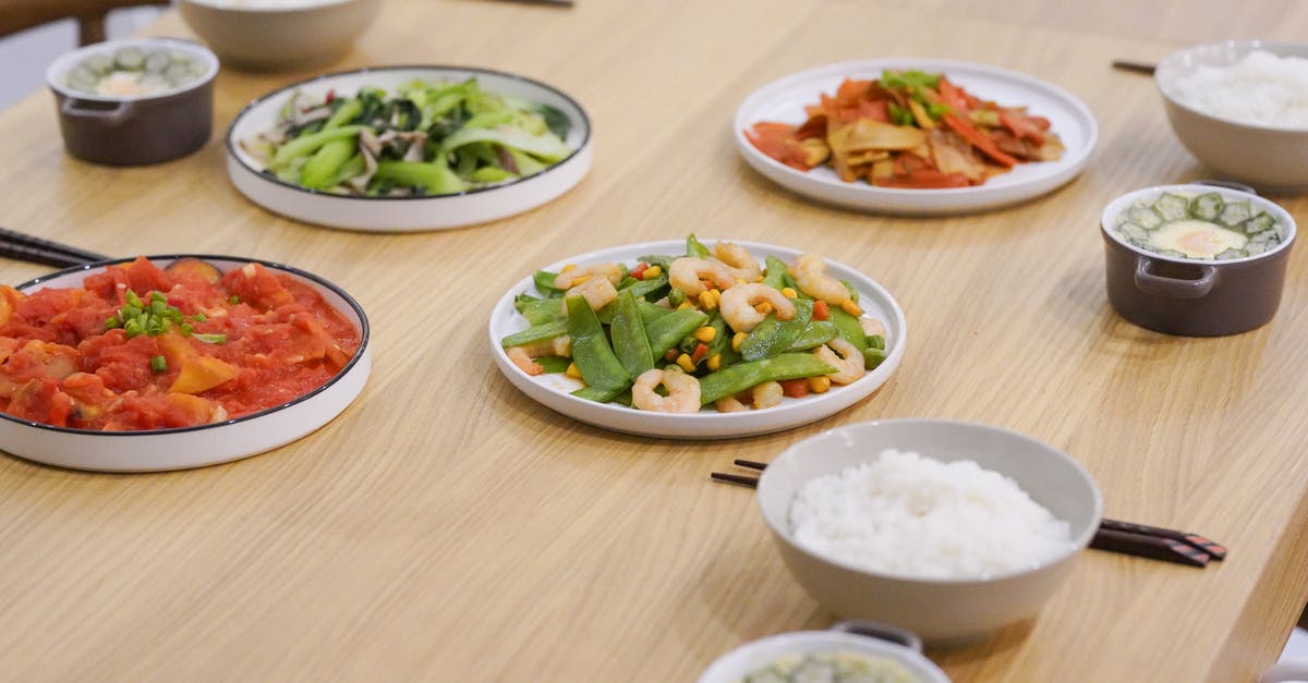 How can I judge the extra amount of water to use if I am cooking rice with extras in in my rice cooker? - Three Bowls of Rice and Four Vegetable Meals on the Table How can I judge the extra amount of water to use if I am cooking rice with extras in in my rice cooker? - Three Bowls of Rice and Four Vegetable Meals on the Table