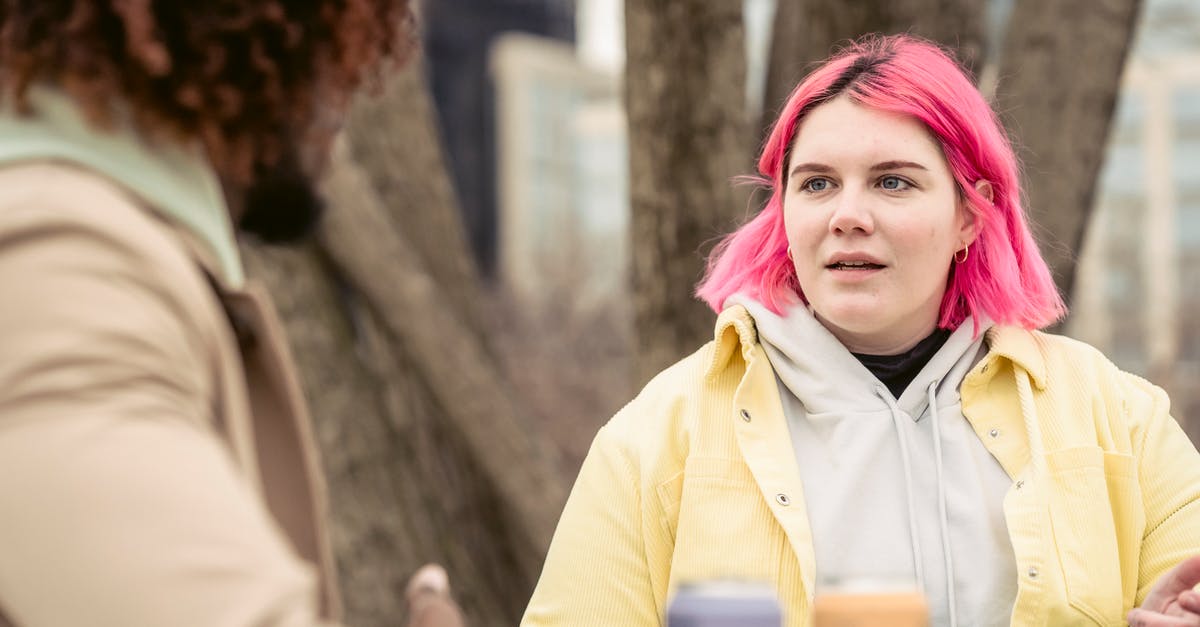 How can I keep corned beef pink? - Woman speaking with faceless black man in park How can I keep corned beef pink? - Woman speaking with faceless black man in park