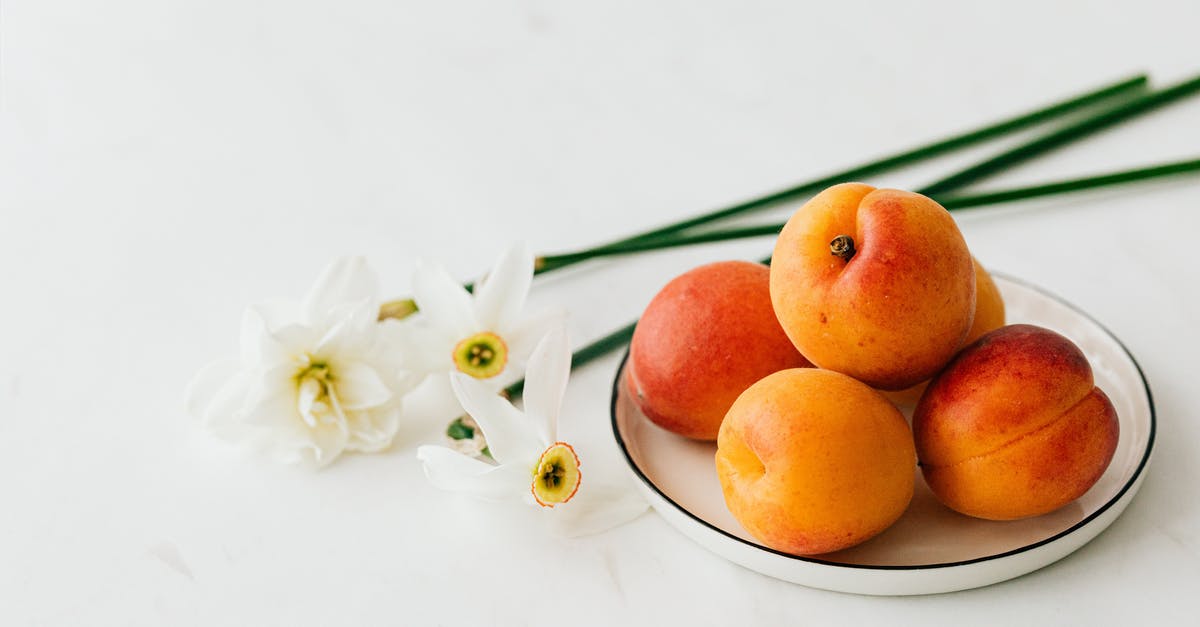 How can I keep delicate food from sticking to the grill? - From above of appetizing ripe apricots in ceramic plate composed with fresh delicate white narcissus flowers How can I keep delicate food from sticking to the grill? - From above of appetizing ripe apricots in ceramic plate composed with fresh delicate white narcissus flowers