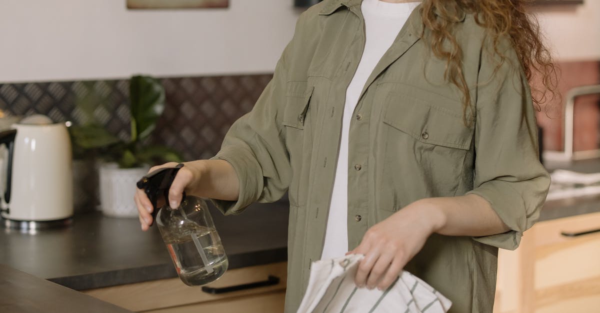 How can I keep flies out of my kitchen? - Woman in Gray Coat Holding Clear Glass Mug How can I keep flies out of my kitchen? - Woman in Gray Coat Holding Clear Glass Mug