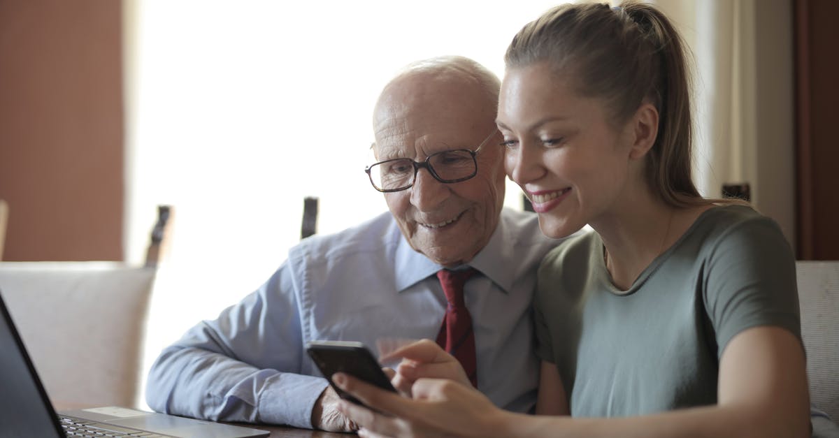 How can I make caramel that will hold its shape, without using refined sugar? - Smiling young woman in casual clothes showing smartphone to interested senior grandfather in formal shirt and eyeglasses while sitting at table near laptop How can I make caramel that will hold its shape, without using refined sugar? - Smiling young woman in casual clothes showing smartphone to interested senior grandfather in formal shirt and eyeglasses while sitting at table near laptop