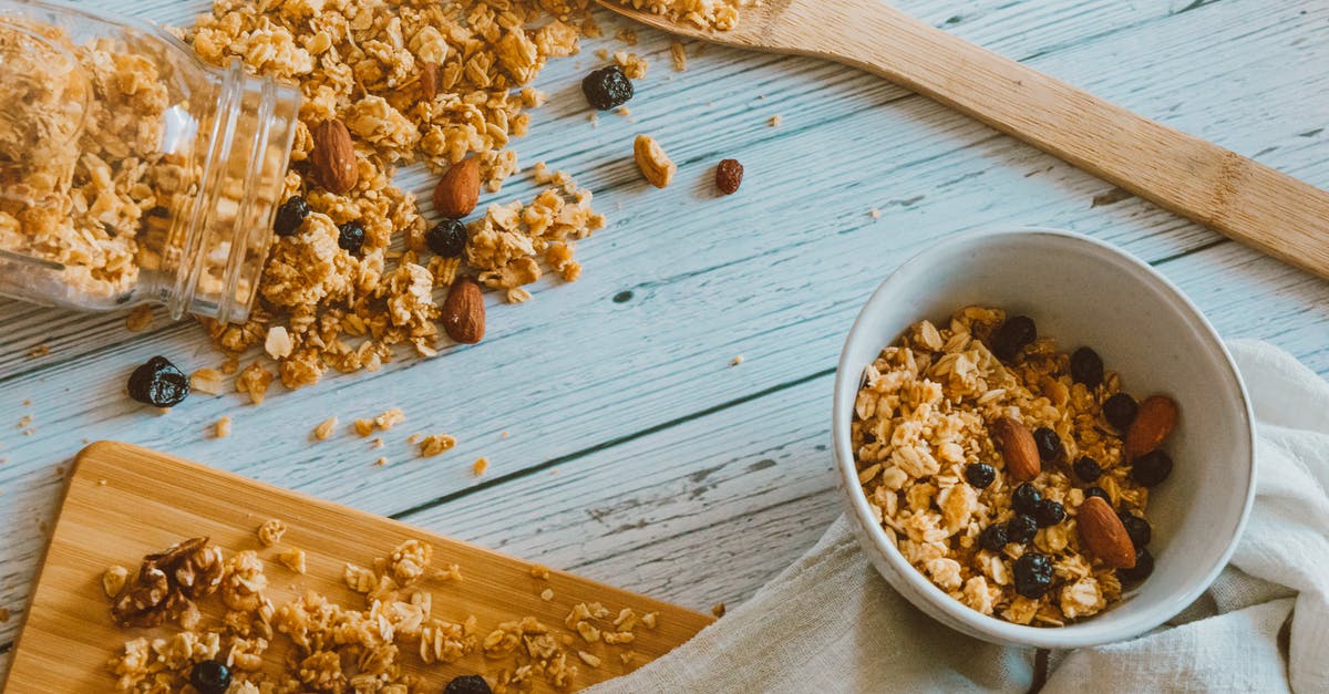 How can I make granola that clumps? - Brown Wooden Spoon Beside White Ceramic Bowl With Brown and White Food How can I make granola that clumps? - Brown Wooden Spoon Beside White Ceramic Bowl With Brown and White Food