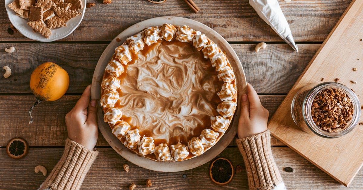 How can I make my carrot cake taste more carroty - Top view crop anonymous female in sweater serving freshly baked yummy pie with whipped cream on wooden table How can I make my carrot cake taste more carroty - Top view crop anonymous female in sweater serving freshly baked yummy pie with whipped cream on wooden table