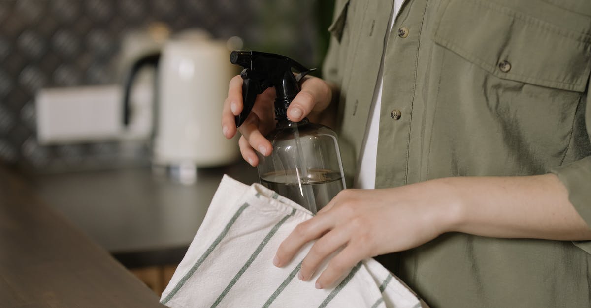 How can I mill / press sweet sorghum with household equipment? - Person in Green Button Up Shirt Holding Clear Drinking Glass How can I mill / press sweet sorghum with household equipment? - Person in Green Button Up Shirt Holding Clear Drinking Glass