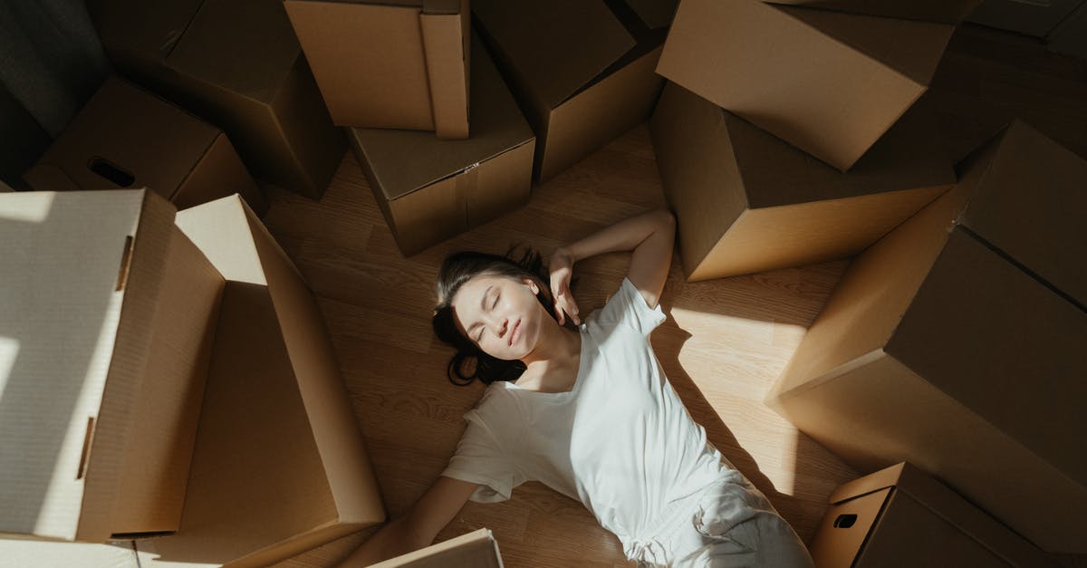 How can I move from subscription boxes to recipes successfully? - Woman in White Long Sleeve Shirt Lying on Brown Cardboard Box How can I move from subscription boxes to recipes successfully? - Woman in White Long Sleeve Shirt Lying on Brown Cardboard Box