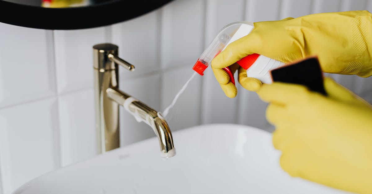 How can I prevent my sponge cake(genoise) from sinking after baking? [duplicate] - From above anonymous housekeeper in yellow rubber gloves spraying cleaner to chrome water faucet in bathroom