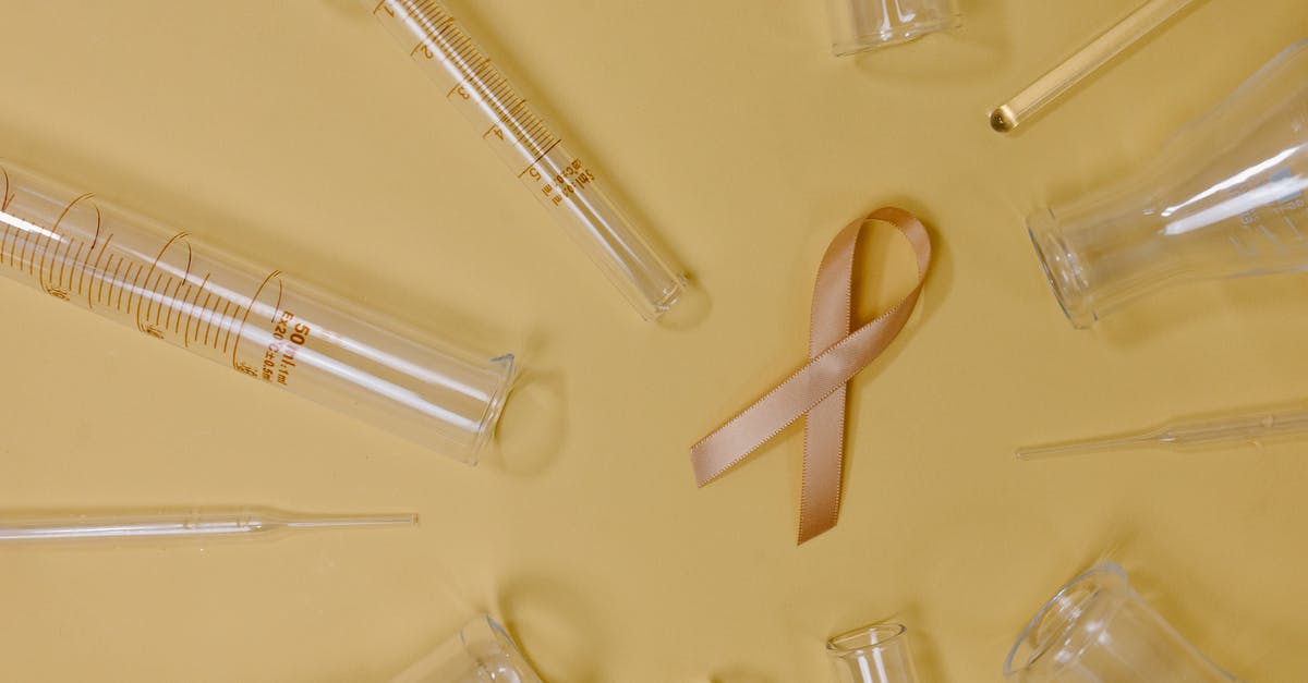 How can I prevent simple syrup from crystallizing? - Top view of pink ribbon representing cancer placed on yellow background among glass test tubes and flasks in light studio How can I prevent simple syrup from crystallizing? - Top view of pink ribbon representing cancer placed on yellow background among glass test tubes and flasks in light studio