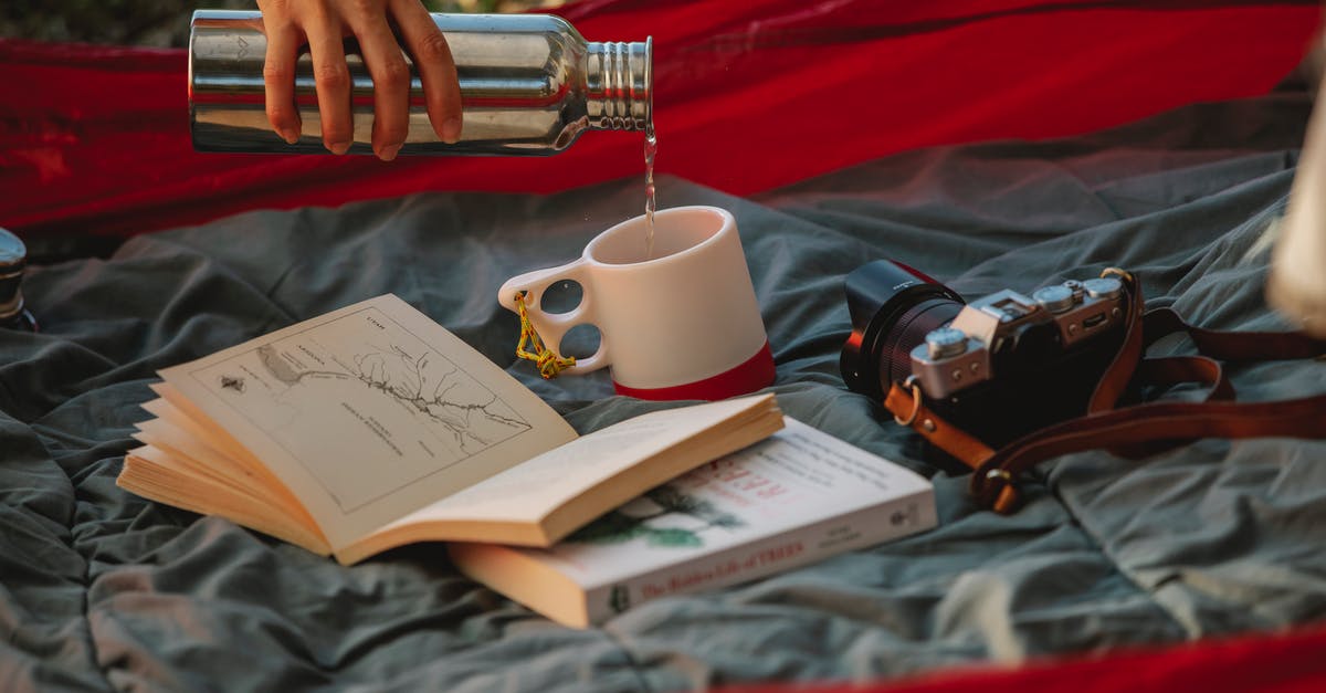 How can I prevent tea stored in a thermos from oversteeping? - Crop faceless woman pouring tea from thermos during picnic