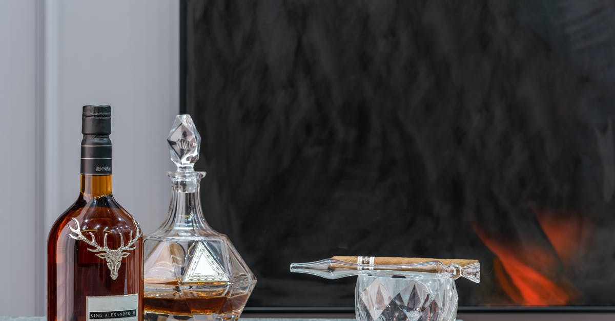 How can I remove a stuck liquor decanter stopper? - Bottle and decanter with expensive alcoholic drink near ornamental glass with cigar in house room How can I remove a stuck liquor decanter stopper? - Bottle and decanter with expensive alcoholic drink near ornamental glass with cigar in house room