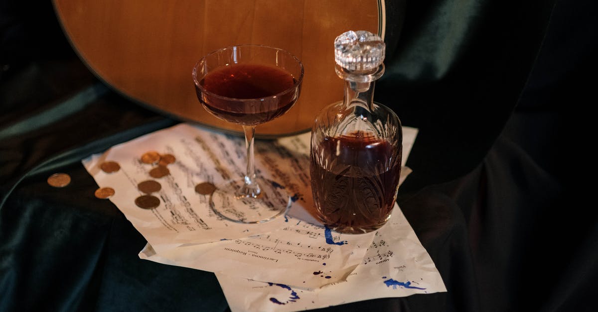 How can I remove a stuck liquor decanter stopper? - Clear Wine Glass with Red Liquid How can I remove a stuck liquor decanter stopper? - Clear Wine Glass with Red Liquid
