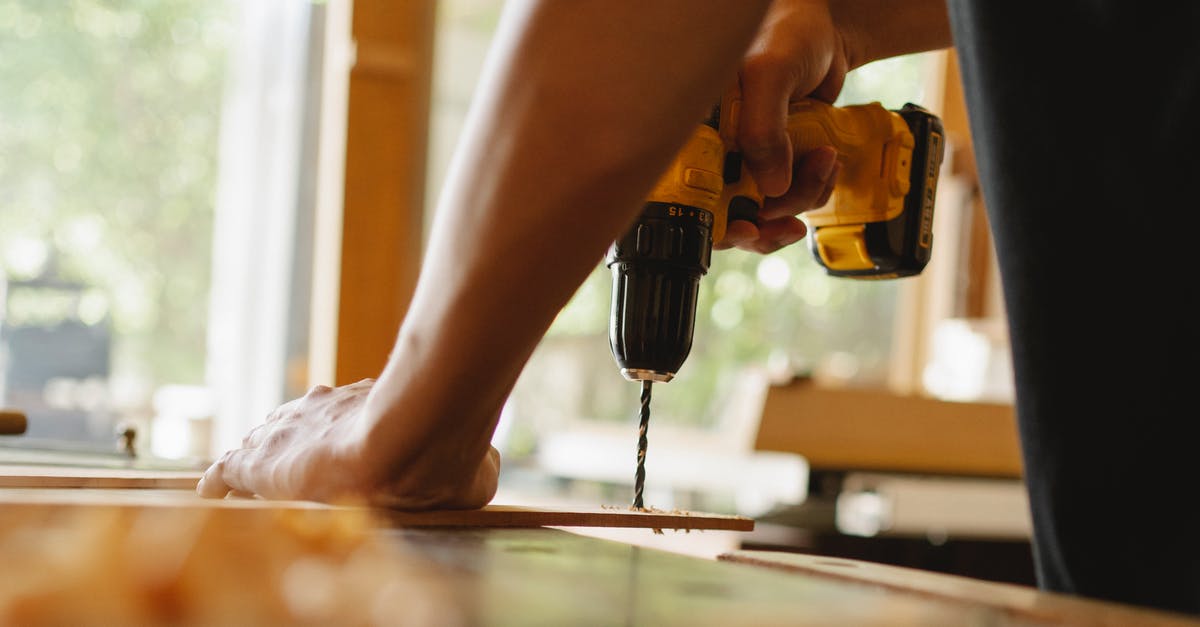 How can I repair a pasta maker that was washed with water and has started to rust? - Man drilling wooden plank on desk How can I repair a pasta maker that was washed with water and has started to rust? - Man drilling wooden plank on desk