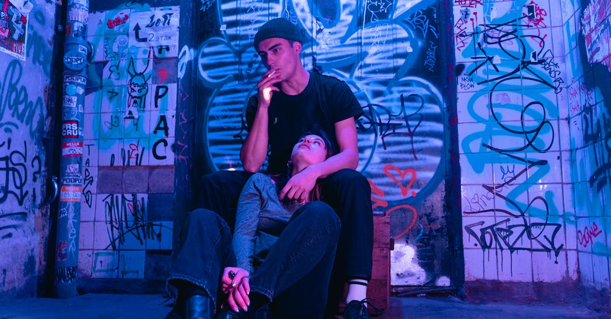 How can I smoke something without a smoker - A Man in Black Shirt Smoking Cigarette while Sitting Near the Woman Looking Up on Him How can I smoke something without a smoker - A Man in Black Shirt Smoking Cigarette while Sitting Near the Woman Looking Up on Him