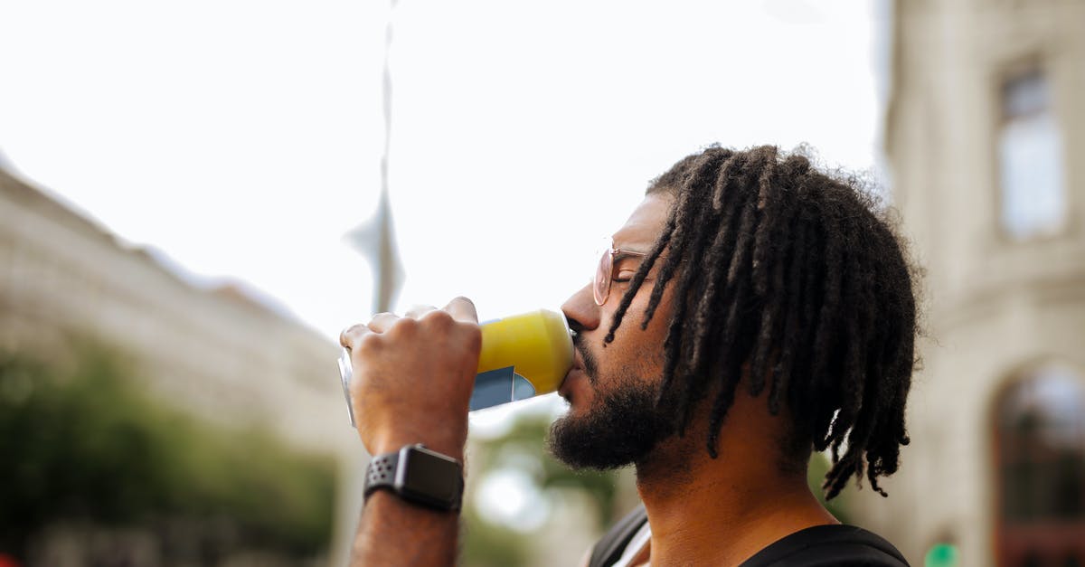 How can I stabilize my hot sauces? - Side view of adult Hispanic guy with dreadlocks in sunglasses and casual clothes with backpack and smart watch drinking yummy beverage from vivid yellow can while standing with eyes closed on street in downtown How can I stabilize my hot sauces? - Side view of adult Hispanic guy with dreadlocks in sunglasses and casual clothes with backpack and smart watch drinking yummy beverage from vivid yellow can while standing with eyes closed on street in downtown