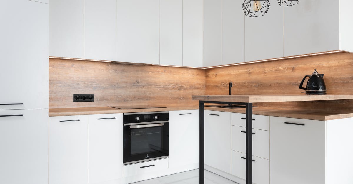 How can I stop puddles of water forming on the shelves of my new refrigerator? - Contemporary interior of kitchen with bar counter and kettle How can I stop puddles of water forming on the shelves of my new refrigerator? - Contemporary interior of kitchen with bar counter and kettle
