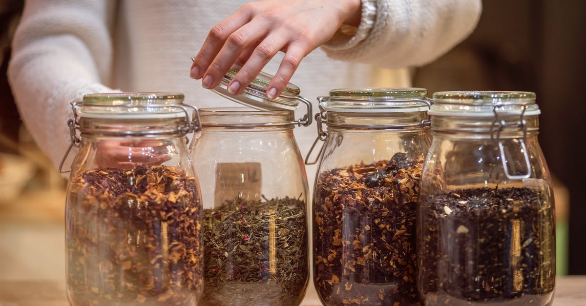 How can I warm bread making ingredients to room temperature? - Female standing at table with glass jars of tea How can I warm bread making ingredients to room temperature? - Female standing at table with glass jars of tea