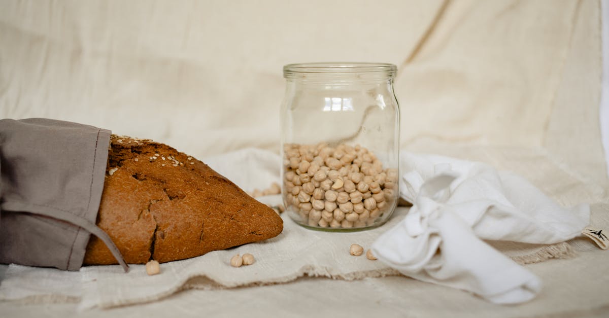 How can I warm bread making ingredients to room temperature? - Brown and White Beans in Clear Glass Jar How can I warm bread making ingredients to room temperature? - Brown and White Beans in Clear Glass Jar