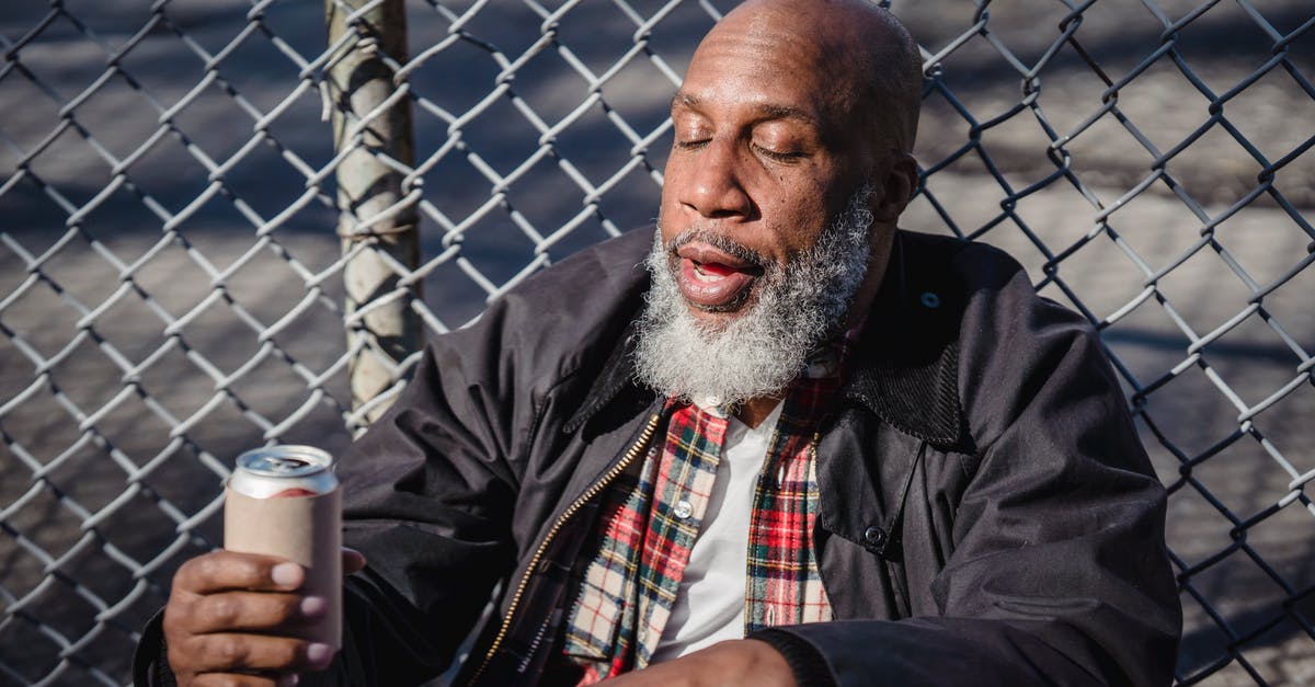 How can one make a reasonable curry with limited spices and poor quality equipment? [closed] - African American homeless man holding beer on street