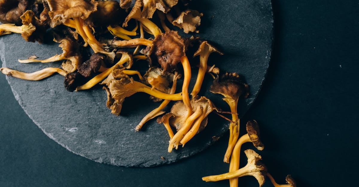 How common are worms in dried mushrooms? - Brown Mushrooms on Black Round Surface How common are worms in dried mushrooms? - Brown Mushrooms on Black Round Surface