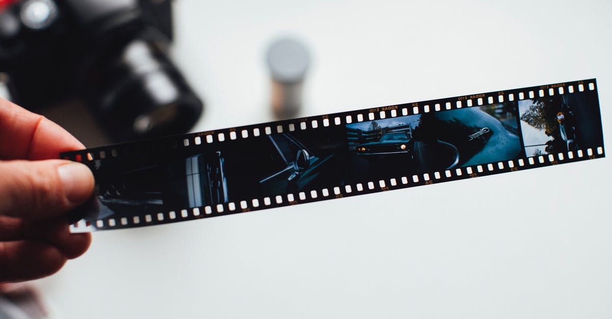 How did I strip the patina off my wok? - Person Holding Film Strip How did I strip the patina off my wok? - Person Holding Film Strip