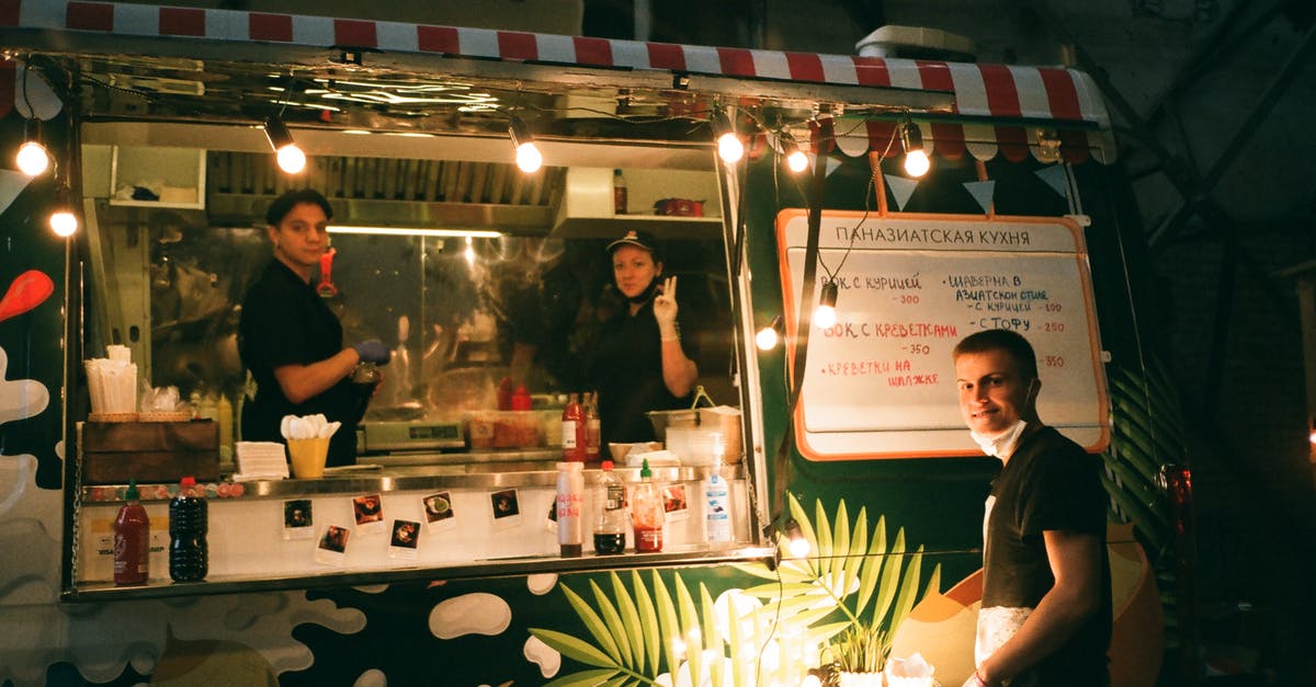 How did people transport food before aluminium foil was invented? - People working in street food truck