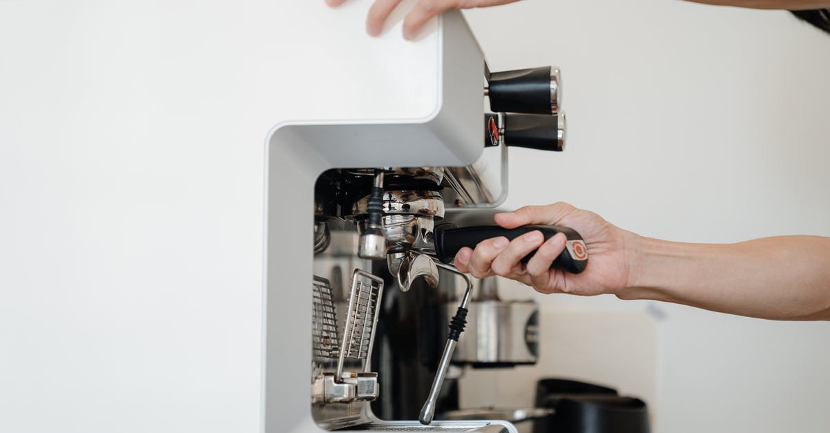 How do espresso machines hold pressure at all? - Person Using Espresso Machine How do espresso machines hold pressure at all? - Person Using Espresso Machine