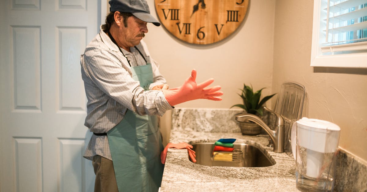 How do I adjust cooking time for an under-powered microwave? - Man in Gray Thobe Standing Near Brown Wooden Round Board How do I adjust cooking time for an under-powered microwave? - Man in Gray Thobe Standing Near Brown Wooden Round Board