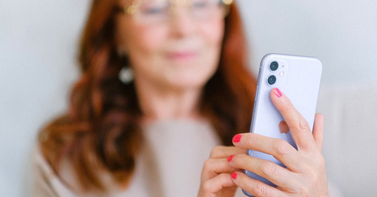 How do I age ginger? - Crop aged redhead female in eyeglasses using contemporary mobile phone while surfing internet in soft focus How do I age ginger? - Crop aged redhead female in eyeglasses using contemporary mobile phone while surfing internet in soft focus