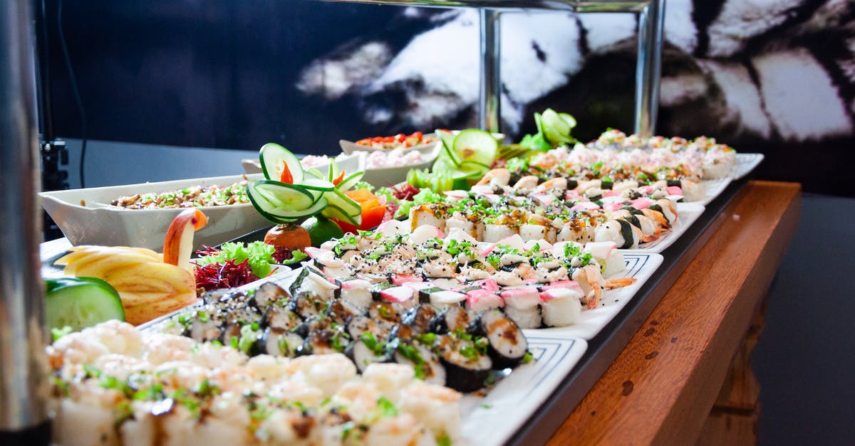 How do I avoid carrot slices rolling away? - Sushi on White Plates on Brown Wooden Table How do I avoid carrot slices rolling away? - Sushi on White Plates on Brown Wooden Table