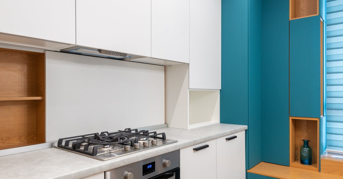 How do I bake cakes in a gas oven without a temperature knob? - White cabinet with gas stove and empty shelves against jalousie in contemporary light house How do I bake cakes in a gas oven without a temperature knob? - White cabinet with gas stove and empty shelves against jalousie in contemporary light house
