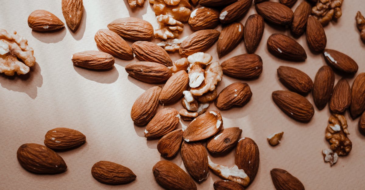 How do I brown nuts without burning and without taking forever? - A Brown Almonds and Walnuts on a Flat Surface How do I brown nuts without burning and without taking forever? - A Brown Almonds and Walnuts on a Flat Surface