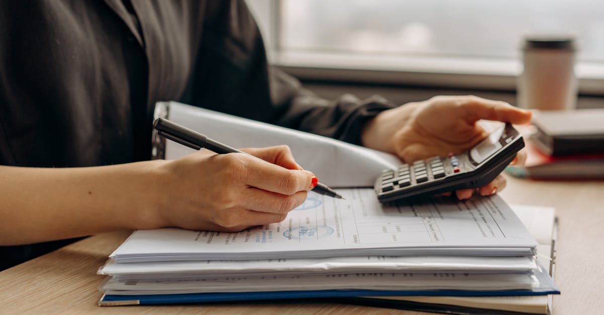 How do I calculate the nutritional values of a recipe? - Person in Long Sleeve Shirt Holding a Calculator How do I calculate the nutritional values of a recipe? - Person in Long Sleeve Shirt Holding a Calculator