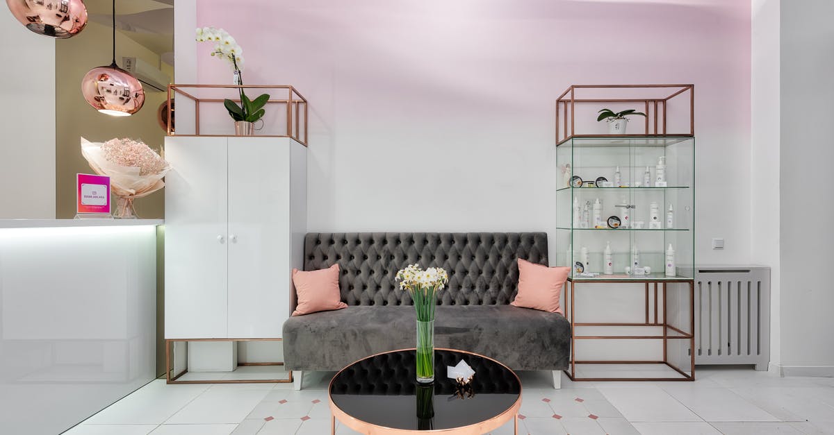 How do I clean a pot after boiling eggs? - Modern lounge interior with sofa between closet and glass cabinet against table with flowers in vase How do I clean a pot after boiling eggs? - Modern lounge interior with sofa between closet and glass cabinet against table with flowers in vase