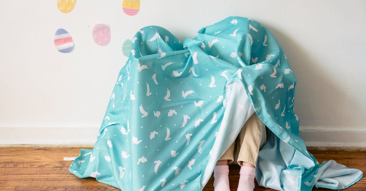 How do I color an egg black? [closed] - Kids hiding under Easter blanket
