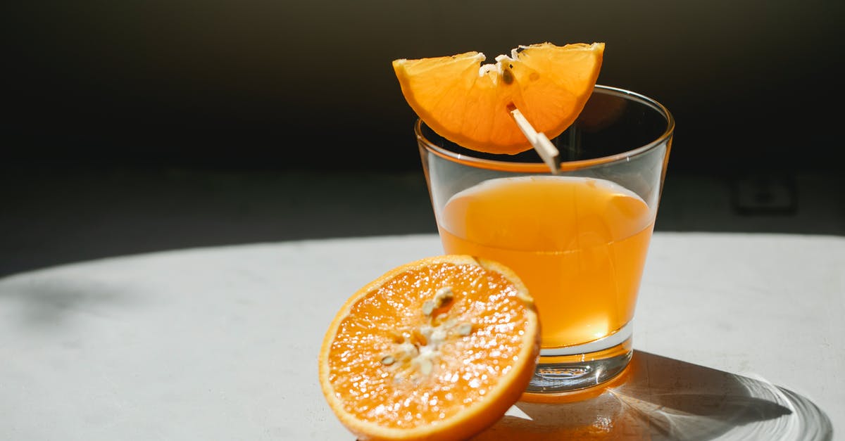 How do I concentrate the flavor in orange juice? - Orange pieces with glass of juice How do I concentrate the flavor in orange juice? - Orange pieces with glass of juice