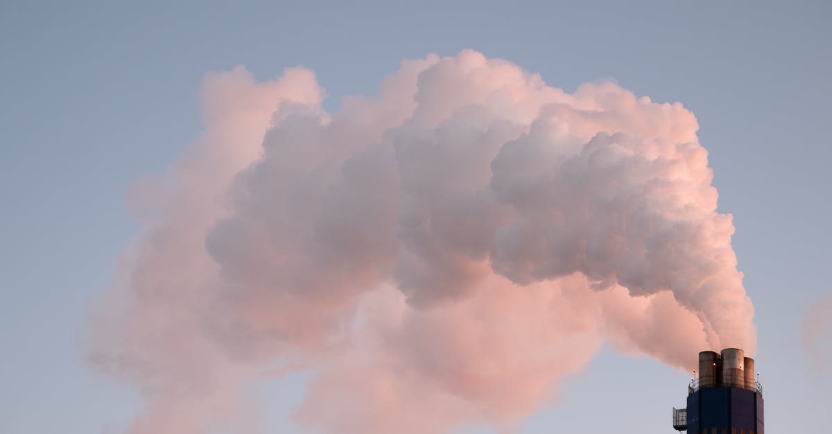 How do I control the smoke from a chimney starter? - From below of clouds of smoke from industrial factory pipes polluting atmosphere against cloudless sky How do I control the smoke from a chimney starter? - From below of clouds of smoke from industrial factory pipes polluting atmosphere against cloudless sky