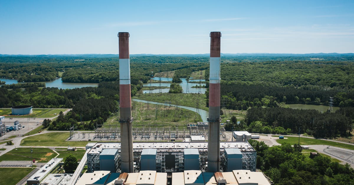 How do I control the smoke from a chimney starter? - Industrial chimneys on power plant platform under sky How do I control the smoke from a chimney starter? - Industrial chimneys on power plant platform under sky