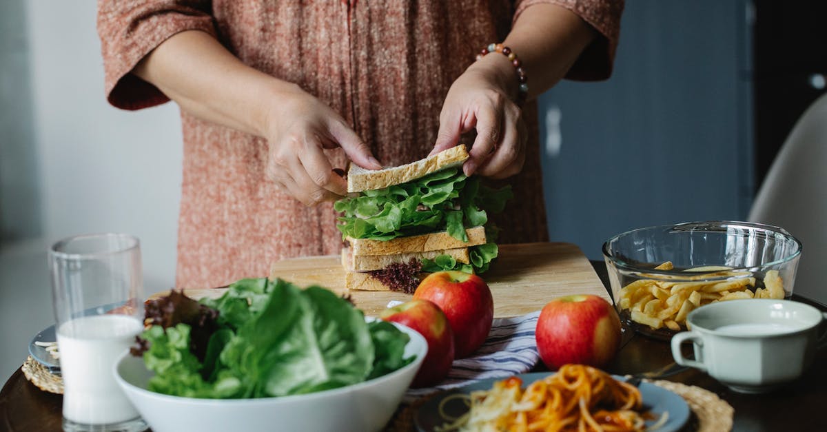 How do I cook toast on an Aga? - Crop woman making sandwich with salad How do I cook toast on an Aga? - Crop woman making sandwich with salad