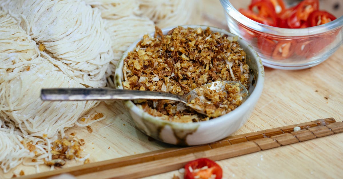 How do I cut savoriness of a dish? - Bowl of spice placed near uncooked noodles on board How do I cut savoriness of a dish? - Bowl of spice placed near uncooked noodles on board