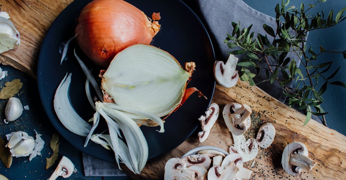 How do I cut savoriness of a dish? - Chopped mushrooms and halved onion on table with herbs and spices How do I cut savoriness of a dish? - Chopped mushrooms and halved onion on table with herbs and spices