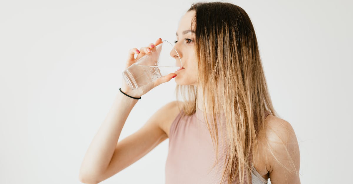 How do I determine if my mussels are fresh? - Young thirsty fit female with long hair in sportswear drinking water while recreating after workout How do I determine if my mussels are fresh? - Young thirsty fit female with long hair in sportswear drinking water while recreating after workout