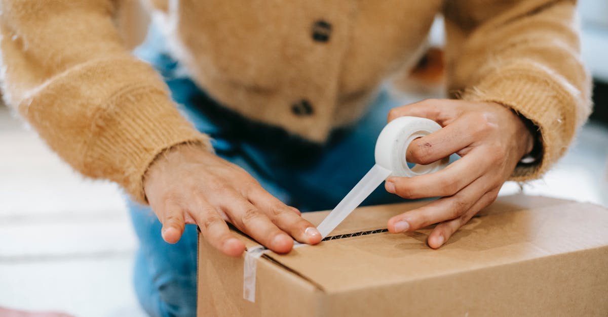 How do I distribute fillings evenly in flan/pudding mix? - Crop unrecognizable woman sealing carton parcel with tape How do I distribute fillings evenly in flan/pudding mix? - Crop unrecognizable woman sealing carton parcel with tape
