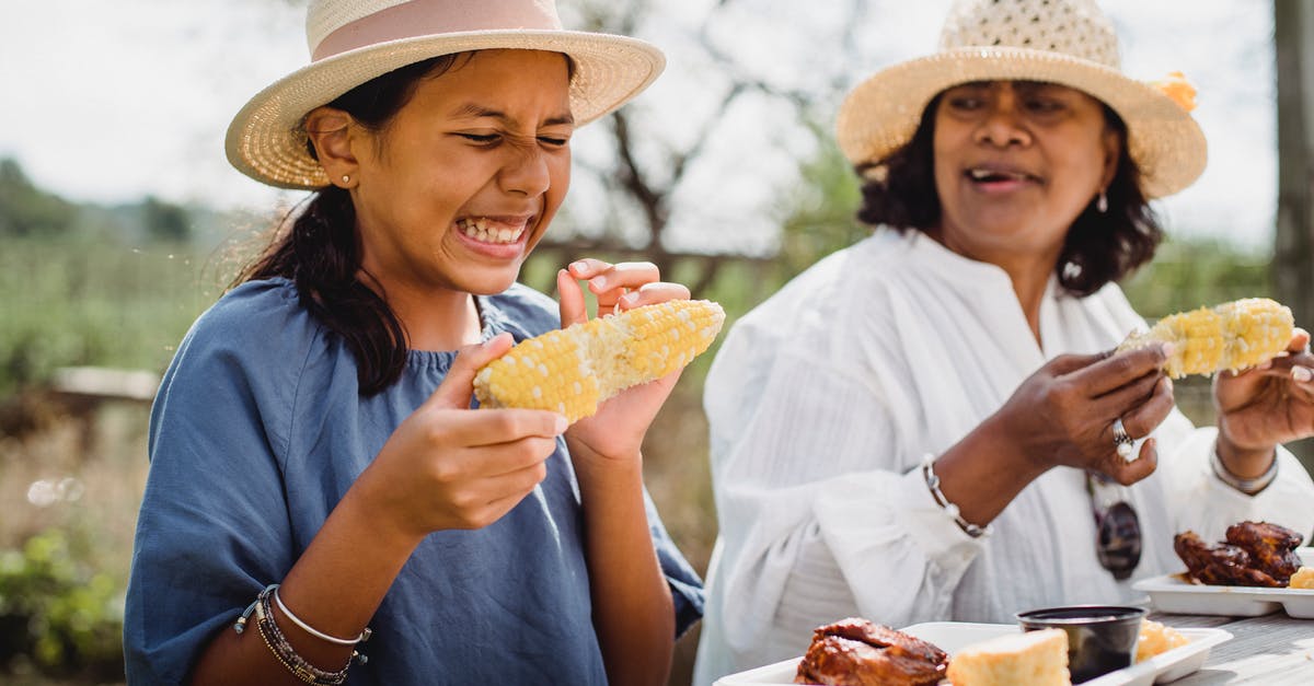 How do I eliminate Corn Meal "grittiness"? - Ethnic funny girl eating with mother in backyard How do I eliminate Corn Meal "grittiness"? - Ethnic funny girl eating with mother in backyard