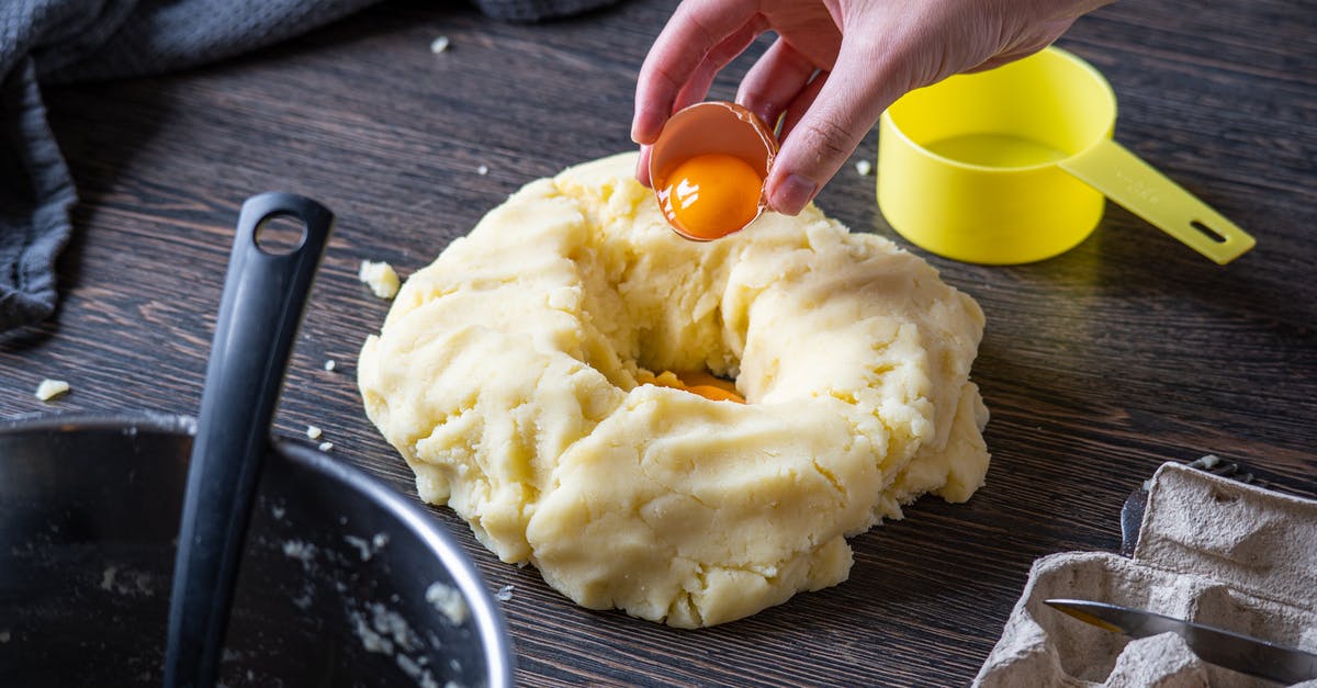 How do I flip an egg when preparing it "over easy"? - Person Putting Egg on a Dough How do I flip an egg when preparing it "over easy"? - Person Putting Egg on a Dough