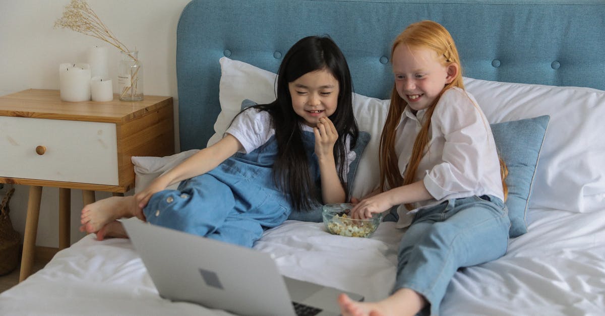 How do I get my home-popped popcorn to be as dry as bagged popcorn? - Full body of happy barefooted diverse children with long hairs lying on comfortable bed and eating popcorn while watching funny cartoon on laptop in cozy room How do I get my home-popped popcorn to be as dry as bagged popcorn? - Full body of happy barefooted diverse children with long hairs lying on comfortable bed and eating popcorn while watching funny cartoon on laptop in cozy room