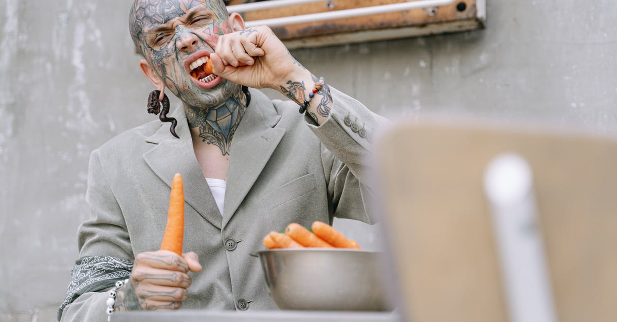 How do I get vegetarian tamales to come out fluffy? - Woman in Gray Coat Holding Orange Fruit
