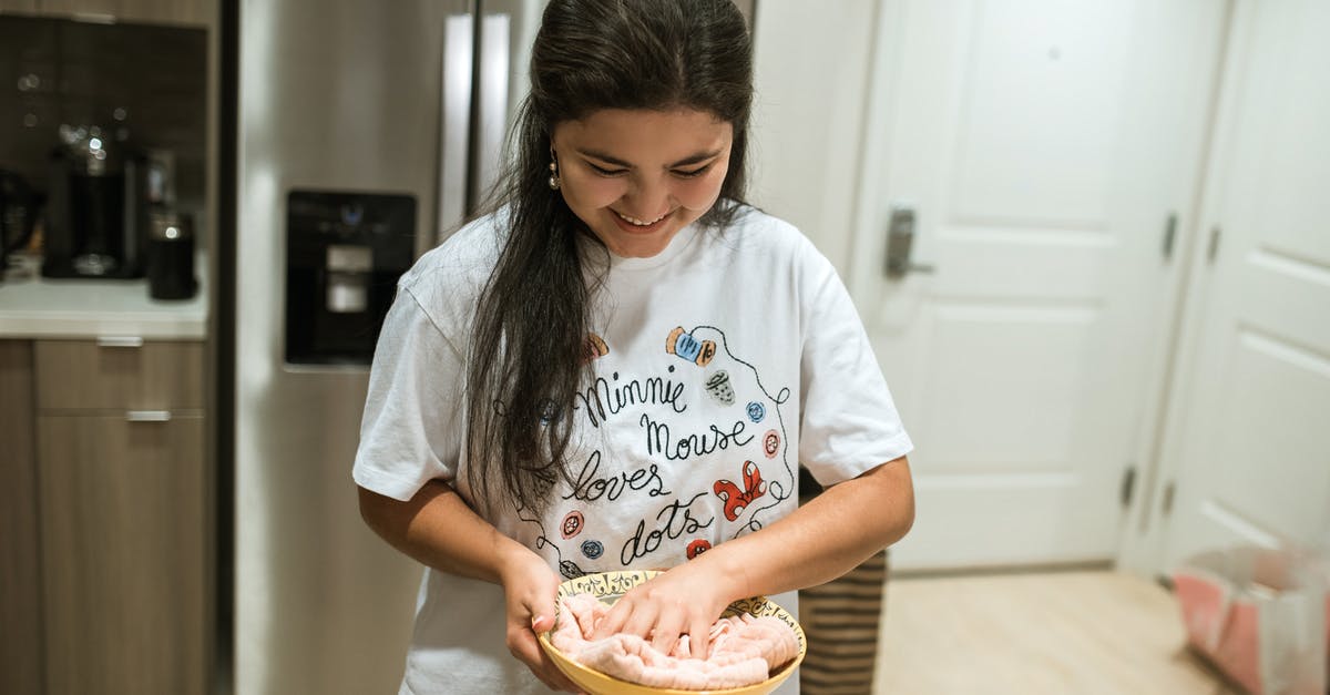 How do I keep dough moist while rising? - Woman in White Crew Neck T-shirt Holding Brown Wooden Tray How do I keep dough moist while rising? - Woman in White Crew Neck T-shirt Holding Brown Wooden Tray