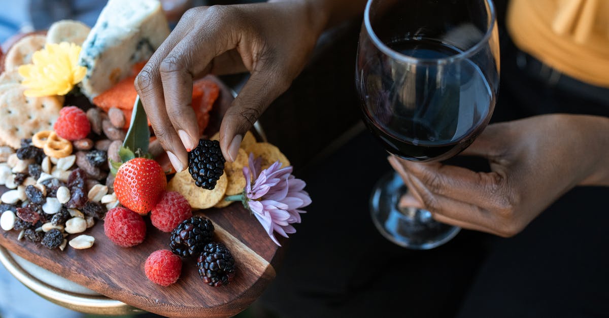 How do I make my cheese "crackers" less greasy? - Hands of Person Holding a Glass of Wine and Blackberry How do I make my cheese "crackers" less greasy? - Hands of Person Holding a Glass of Wine and Blackberry