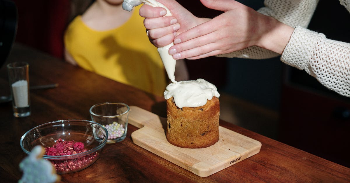 How do I practice piping icing without wasting icing and money? - Person Holding Piping Bag with White Icing How do I practice piping icing without wasting icing and money? - Person Holding Piping Bag with White Icing