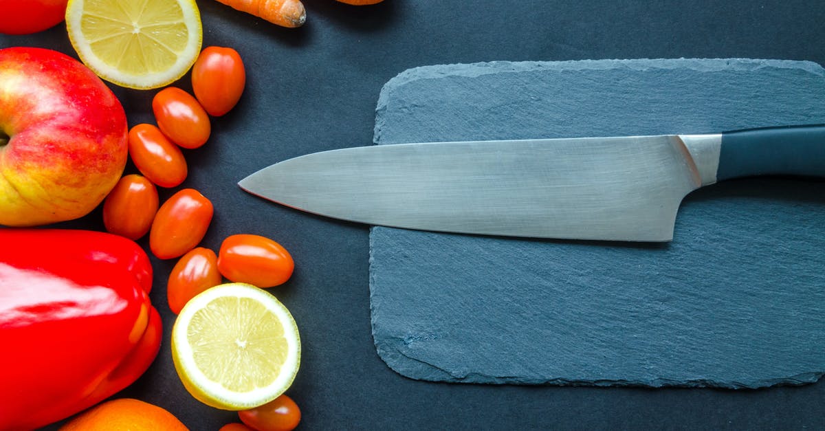 How do I preserve a tomato's freshness after it is cut? - Black Kitchen Knife With Fruits and Vegetable on Table How do I preserve a tomato's freshness after it is cut? - Black Kitchen Knife With Fruits and Vegetable on Table